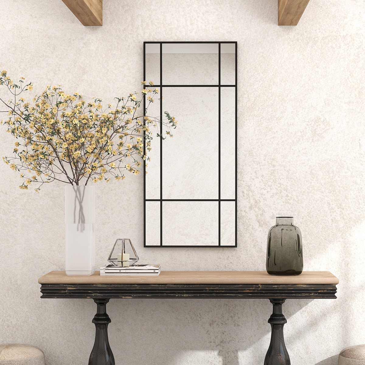 Black grid wall mirror with multi-pane vertical layout, rectangular wall-mounted frame.