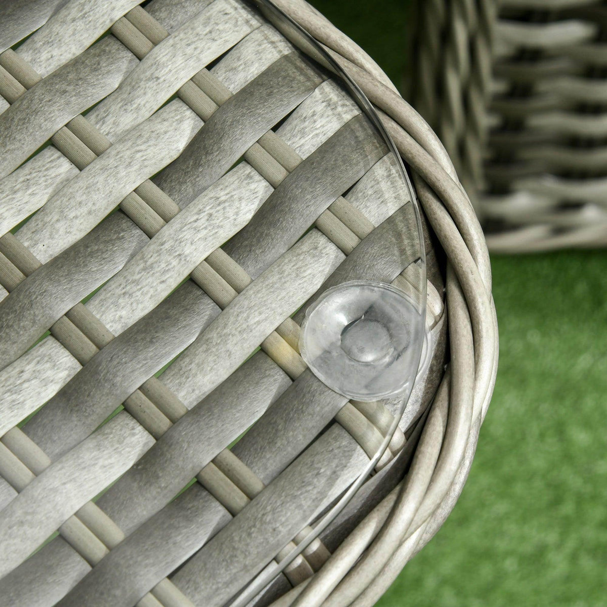 Light gray rattan wicker corner weave detail with rounded edge