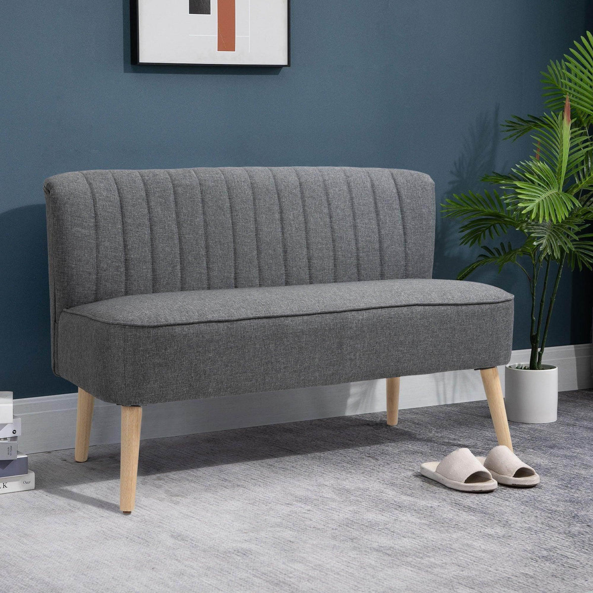 Grey linen-feel double sofa with tufted back, padded seat, and light wood legs