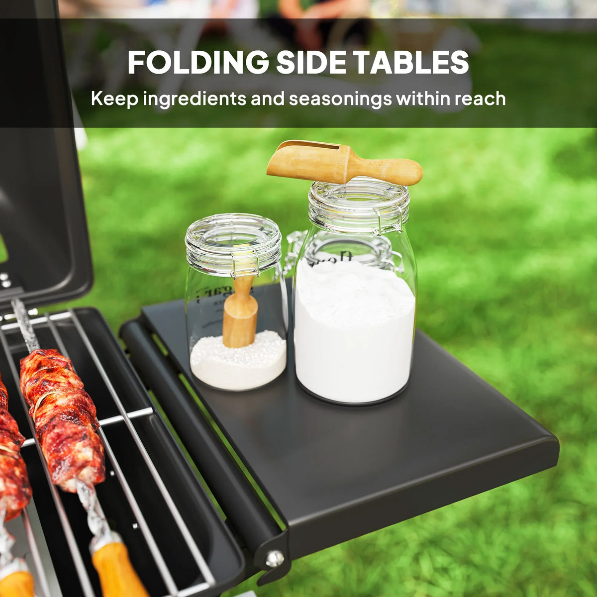 Black two-burner gas grill with open lid and folding side table holding jars and a scoop