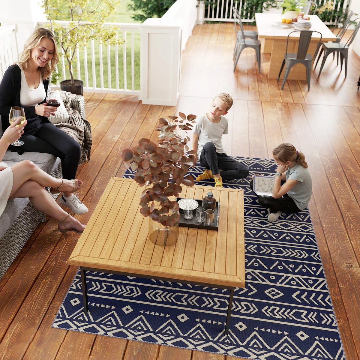 Outdoor rug on deck with dark blue and white geometric pattern