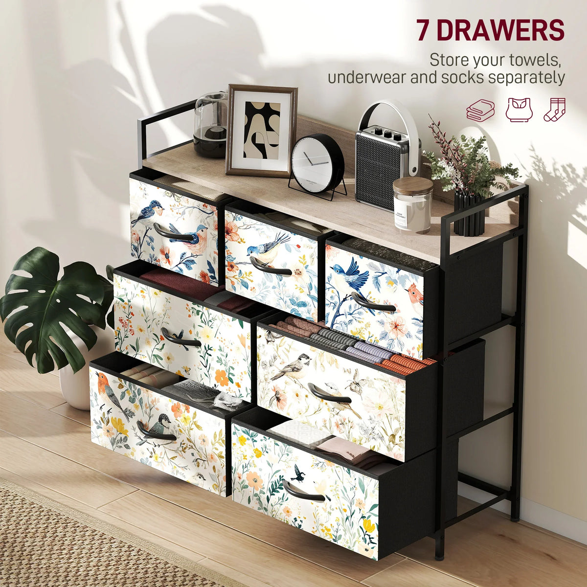 Patterned fabric chest of drawers with seven bins, black frame, top storage shelf