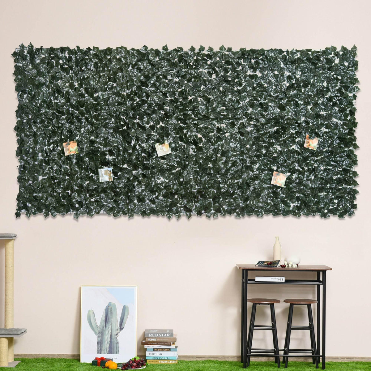 Dark green artificial leaf privacy screen panel with small metal fasteners