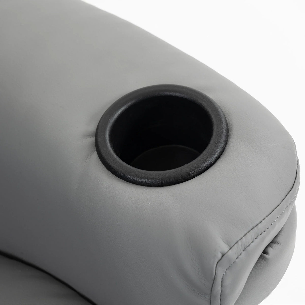 Grey upholstered armchair cup holder detail with black insert