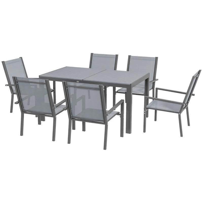 Light grey rectangular dining table with six armchairs, stackable frame