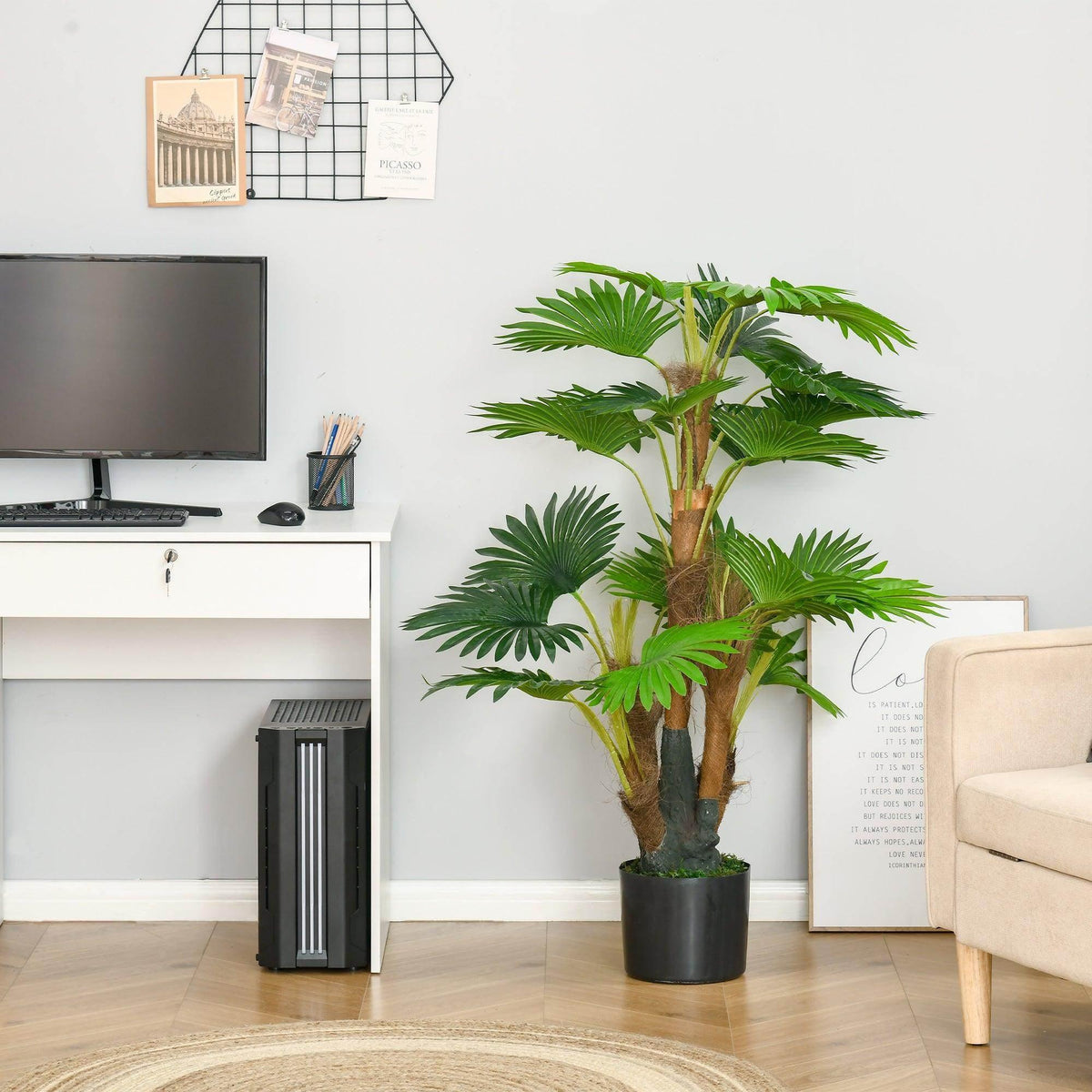 Artificial palm tree with green fronds in a black pot, styled as living room floor decor.