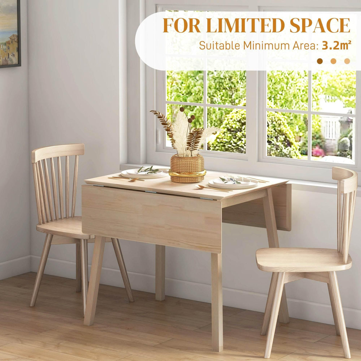 Natural pine drop-leaf dining table with two chairs in a bright room