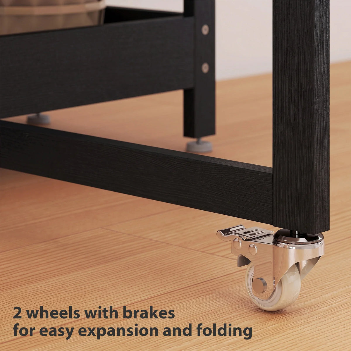 Black dining table on wheels with brakes, black metal frame