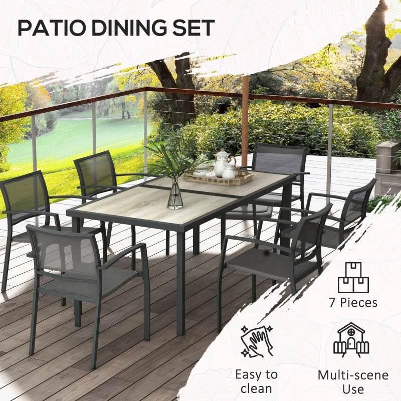 7-piece outdoor dining set with grey table and mesh-back dining chairs