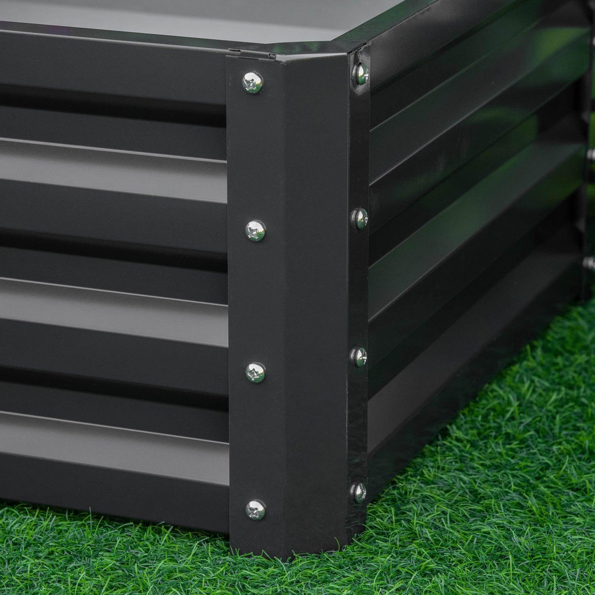 End corner of dark grey raised garden bed with bolted steel frame and legs