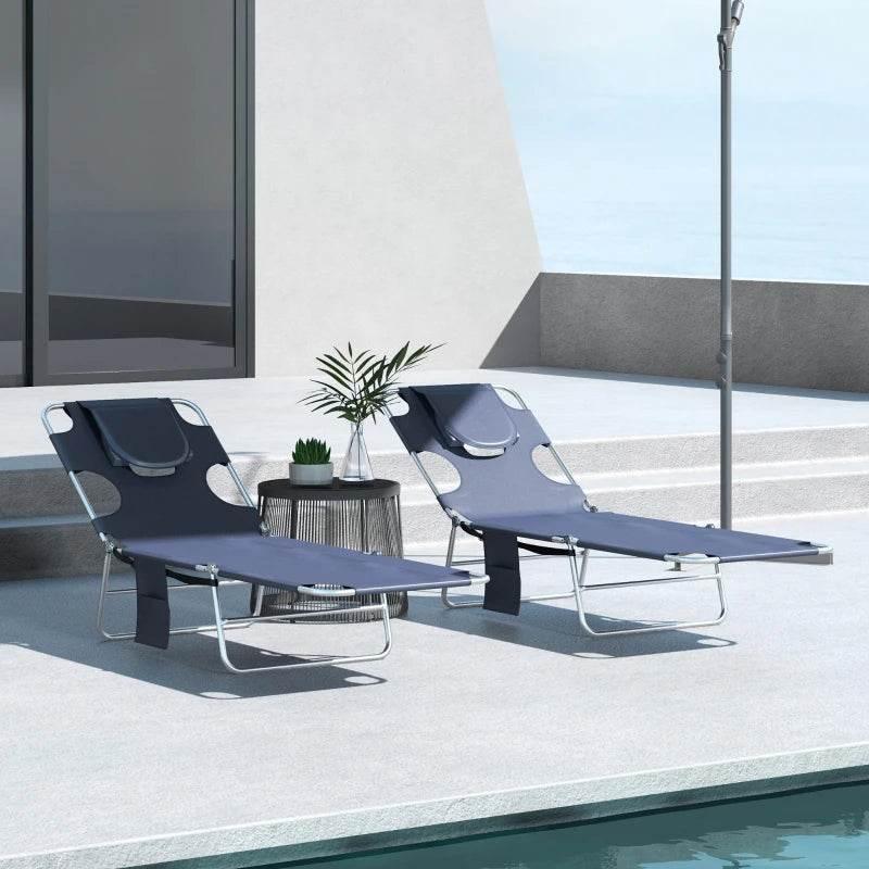 Set of 2 foldable blue sun loungers with adjustable backrests and headrest pillows