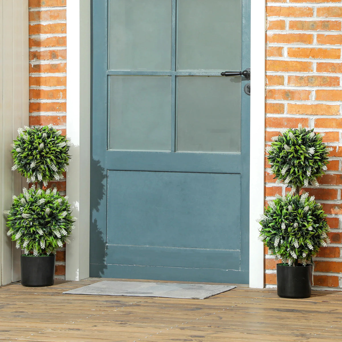 Set of 2 artificial ball topiary trees with green foliage and black pots