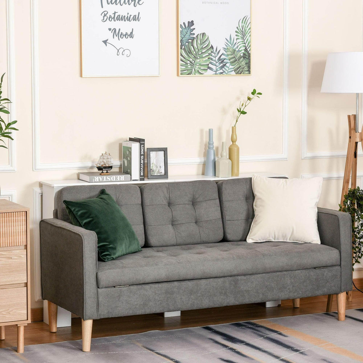 Grey 3-seat sofa with tufted cushions and wooden legs, upholstered arms and back.