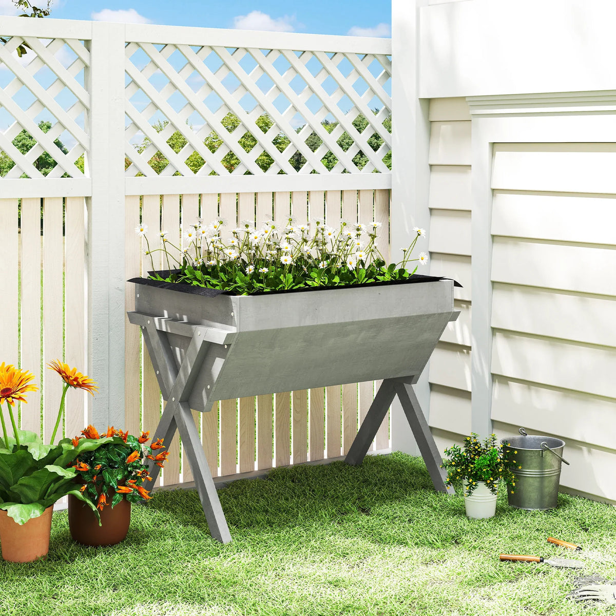 Light grey raised wooden garden bed with black liner and four legs