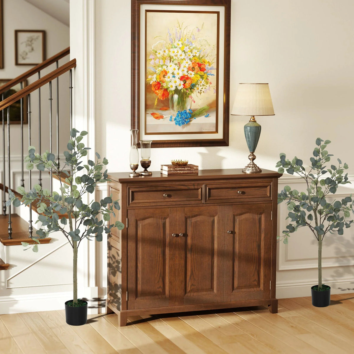 Set of 2 faux eucalyptus trees with gray-green leaves in black pots for indoor decor