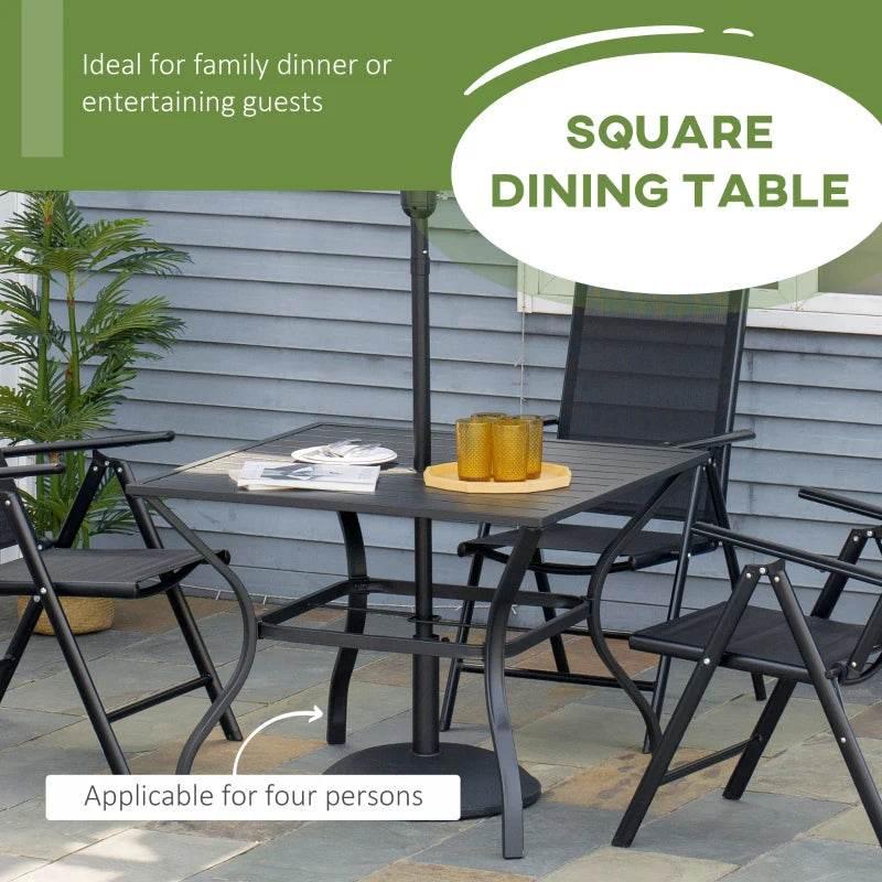 Black outdoor dining table with slatted surface and umbrella pole center