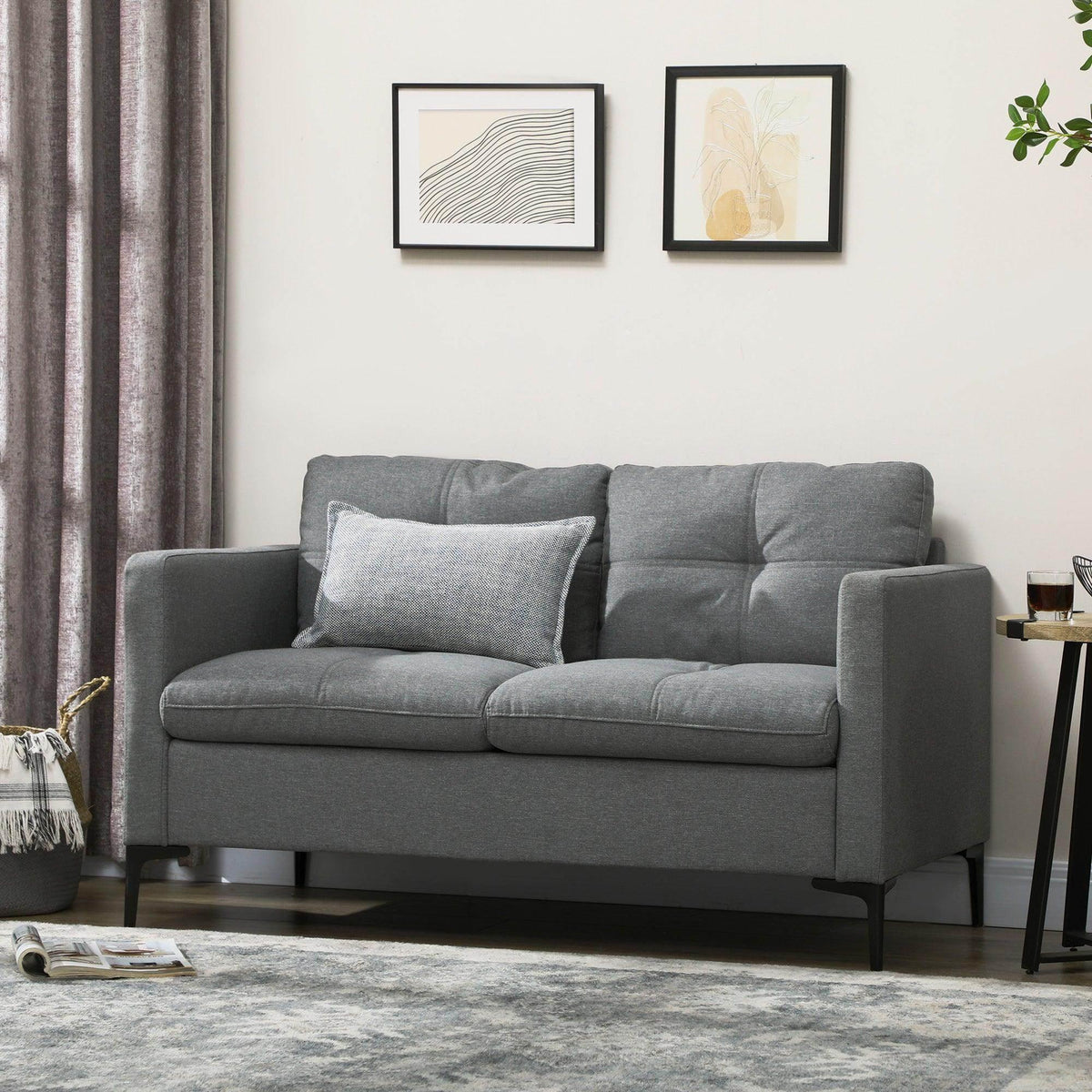 Gray 2-seater loveseat sofa with tufted back and two seat cushions.