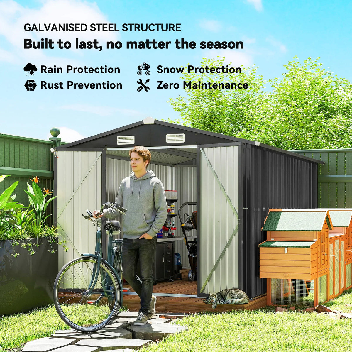 Dark grey metal garden shed with double doors, four vents, and open storage interior