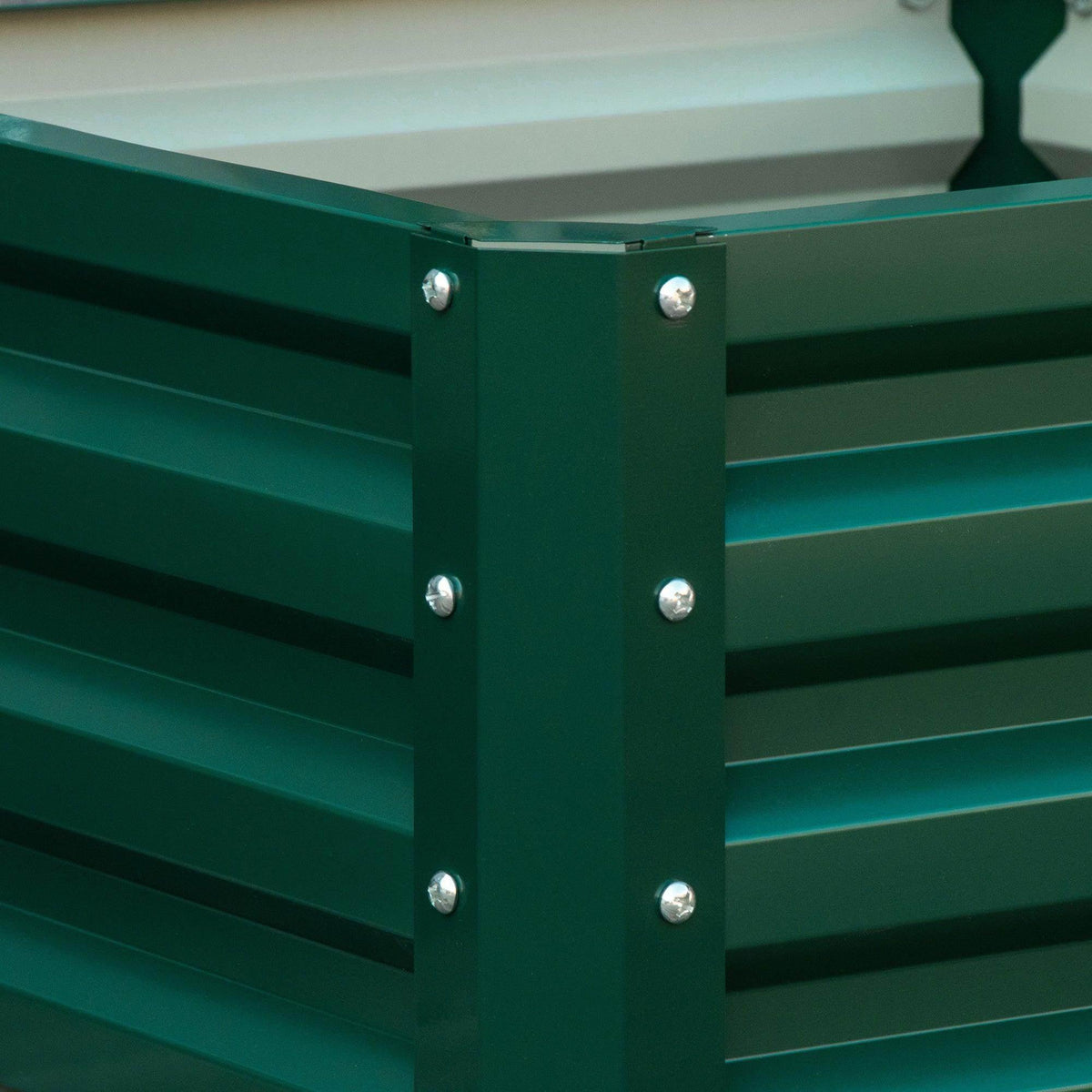 Green raised garden bed corner joint with vertical support posts and shiny bolts