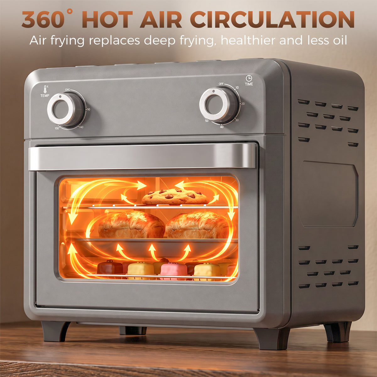 Grey air fryer oven front view with glowing heating chamber through window