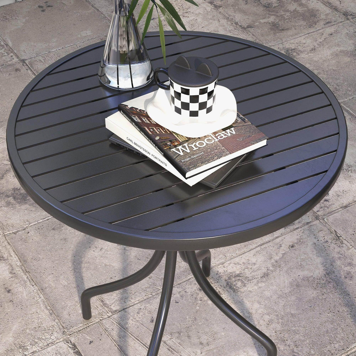 Black round patio side table with slat tabletop and three curved steel legs