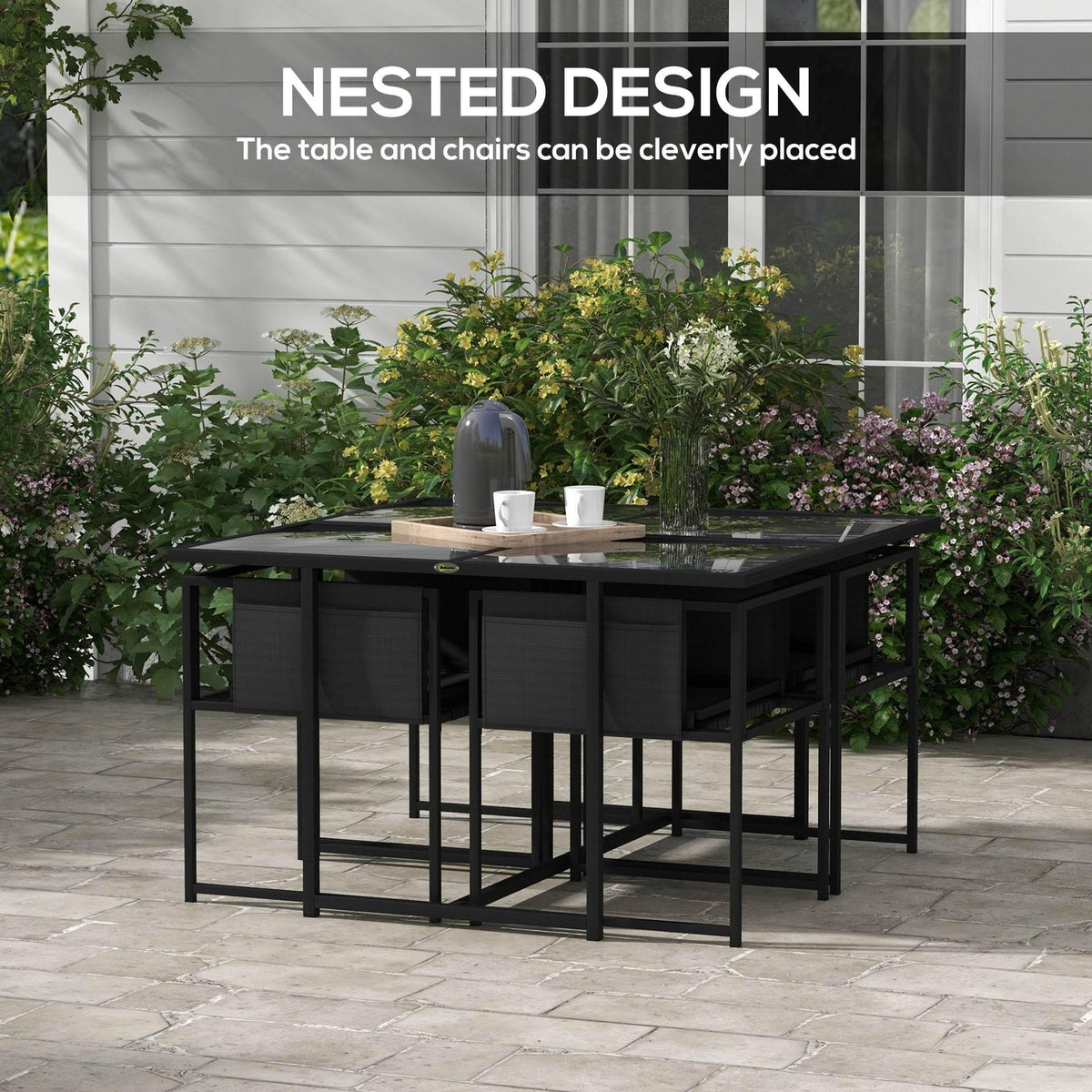 Black outdoor dining table with four matching mesh chairs in row