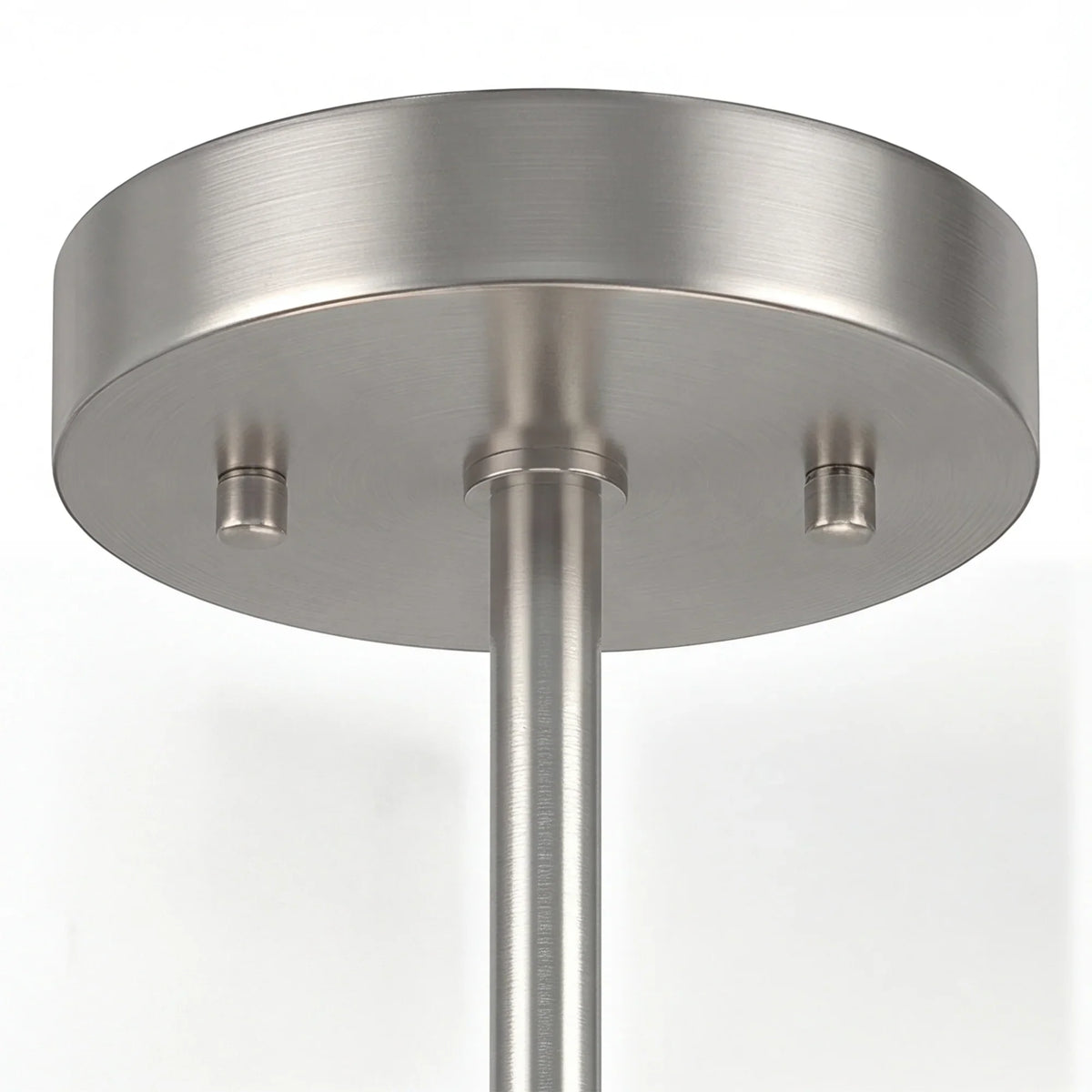Silver semi flush ceiling light with round canopy, central downrod, and three socket fixtures