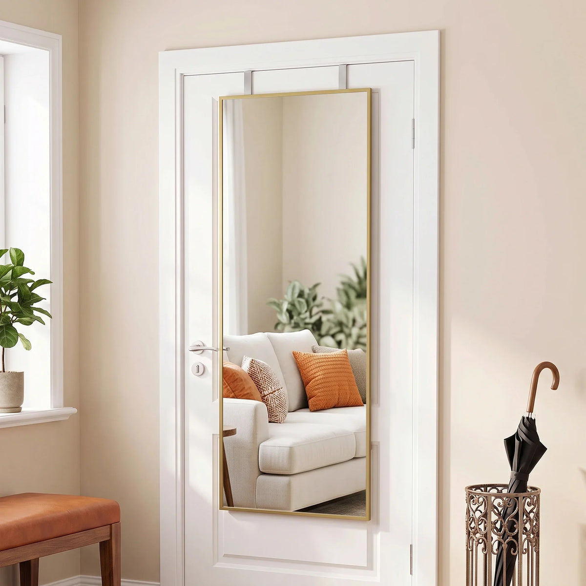 Full length wall mirror with gold-tone frame and adjustable hanging hooks