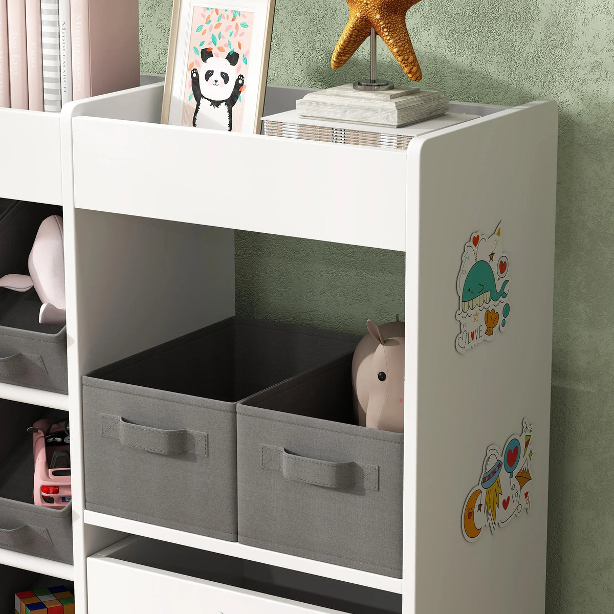 White kids toy storage cabinet with gray fabric bins and animal-printed side panel
