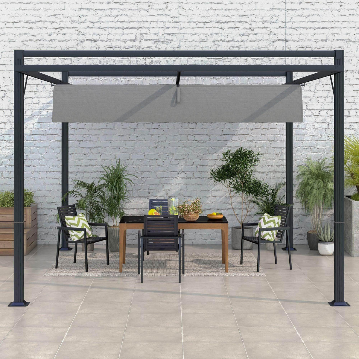 Dark grey retractable pergola over outdoor dining area with light-grey canopy
