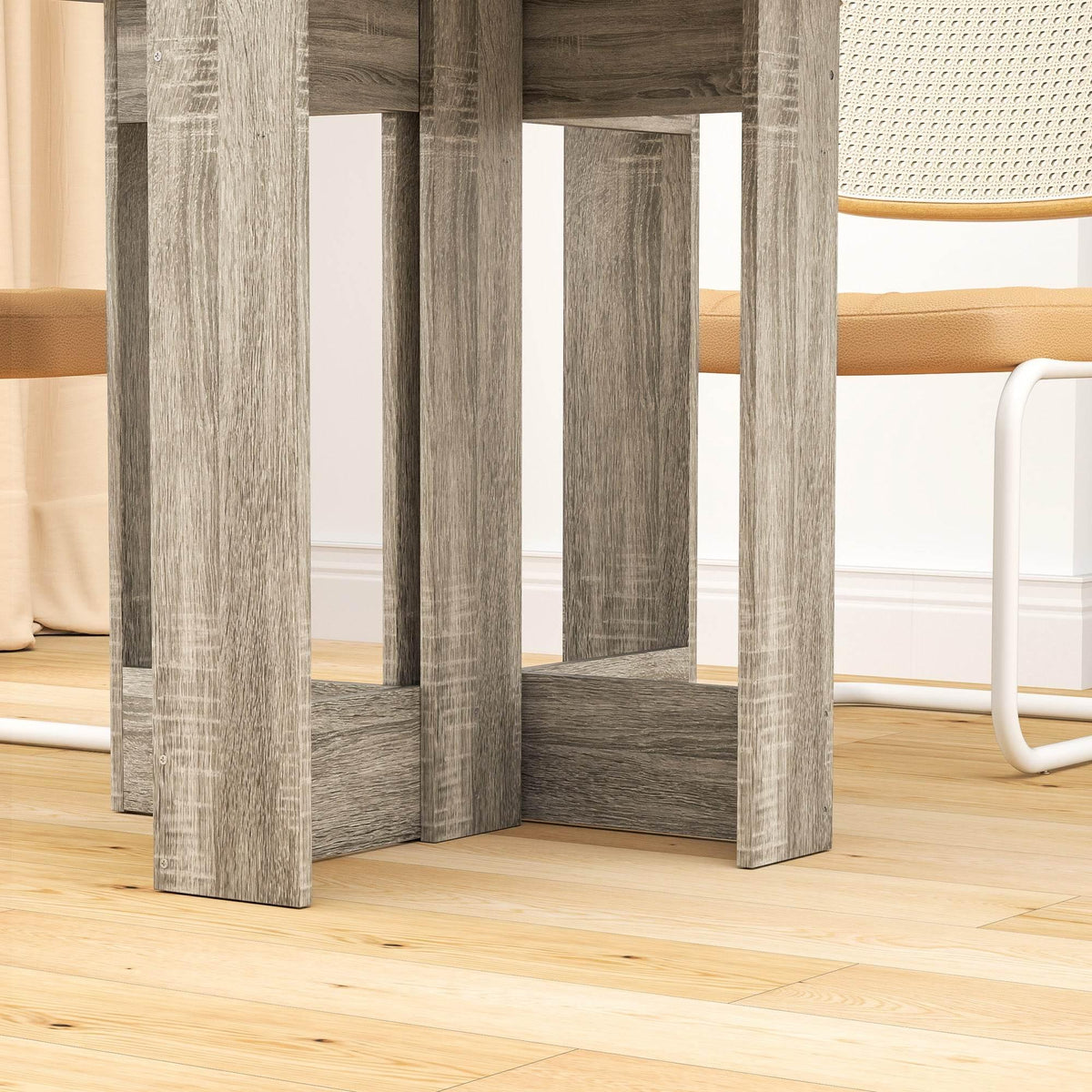 Grey folding drop-leaf dining table underside view with sturdy open-frame legs