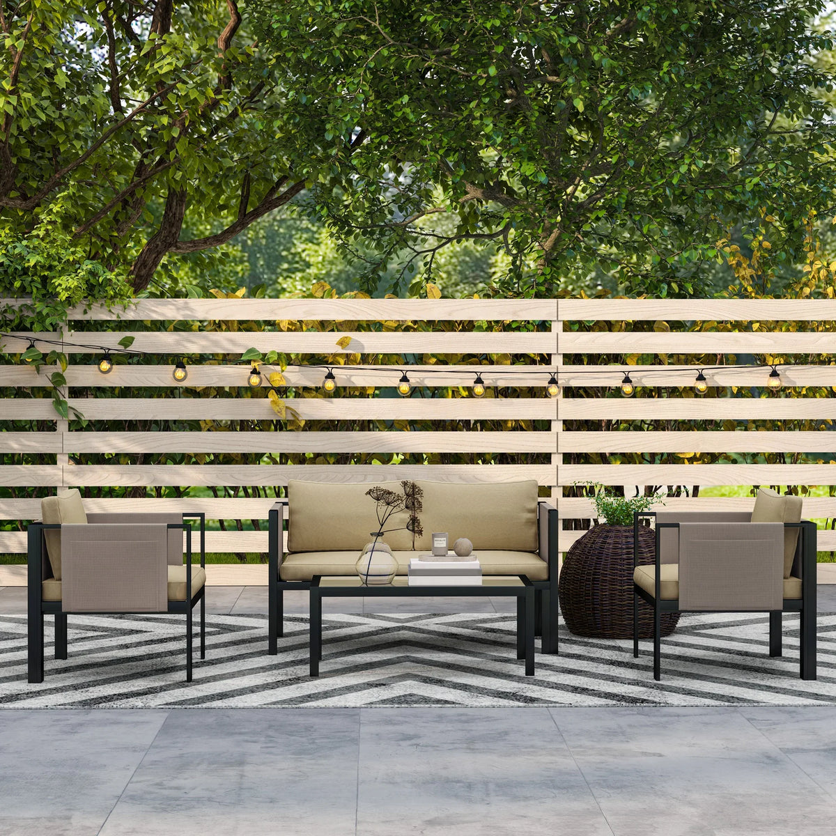 Outdoor patio furniture set with khaki cushions, black frames, and low square coffee table