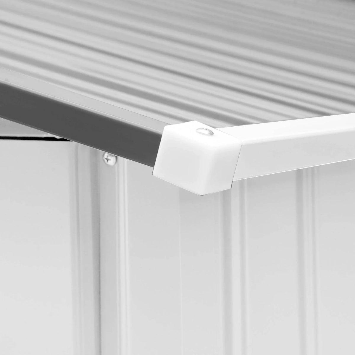 Grey metal roof corner bracket and seam detail for garden storage shed