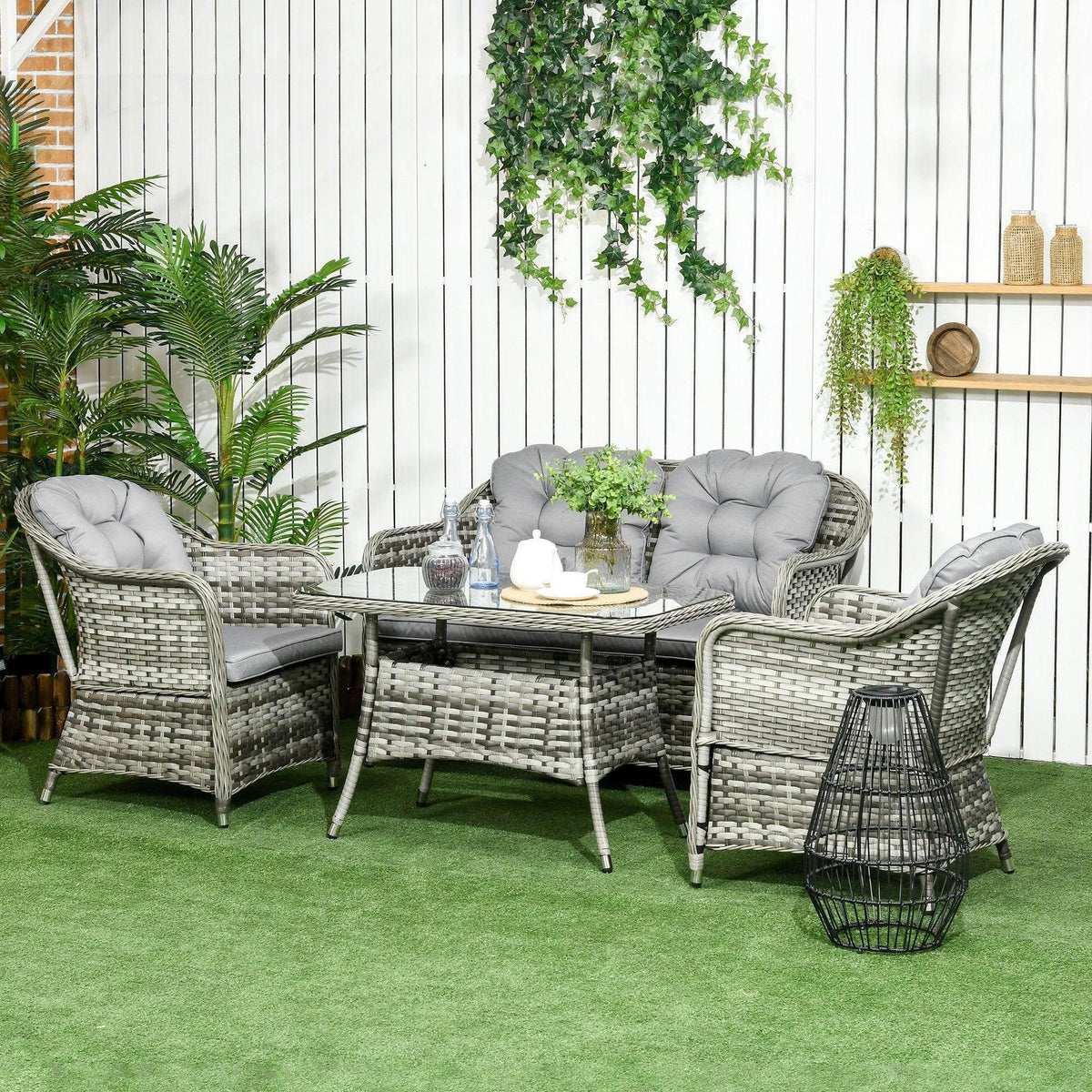 Gray rattan conversation sofa set with padded cushions and tempered glass coffee table