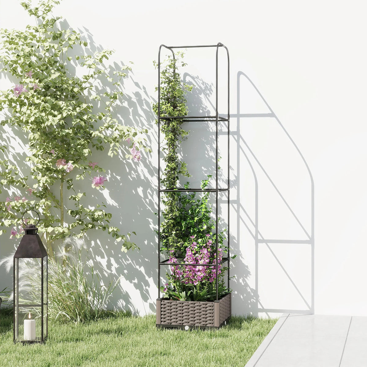 Gray plastic raised garden bed with trellis, potted flowers and leafy vines