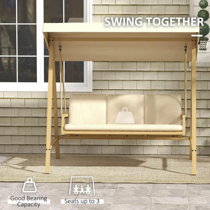 Beige three-seat garden swing chair with canopy and padded cushions against wall