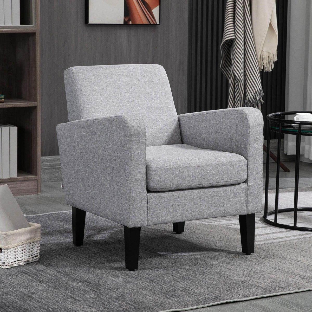 Light grey fabric armchair with curved armrests and black rubber wood legs