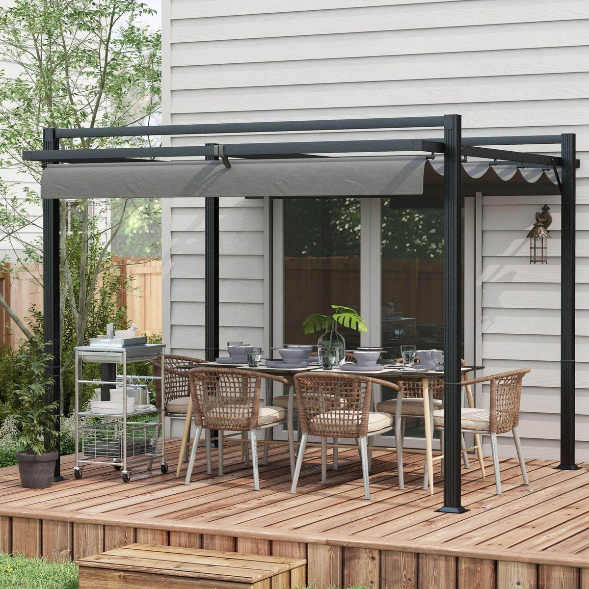 Dark grey retractable pergola with gray canopy over outdoor dining set