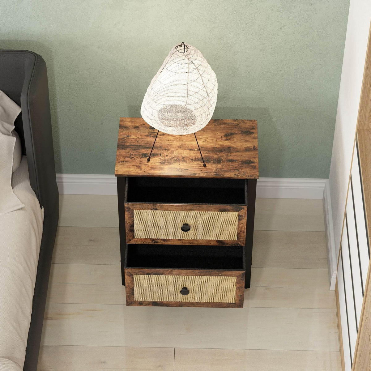 Rattan drawer nightstand with two drawers, rustic top, black frame, and front knob pulls