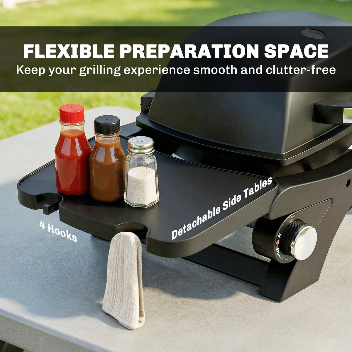 Black gas grill with detachable side tables and condiment storage hooks