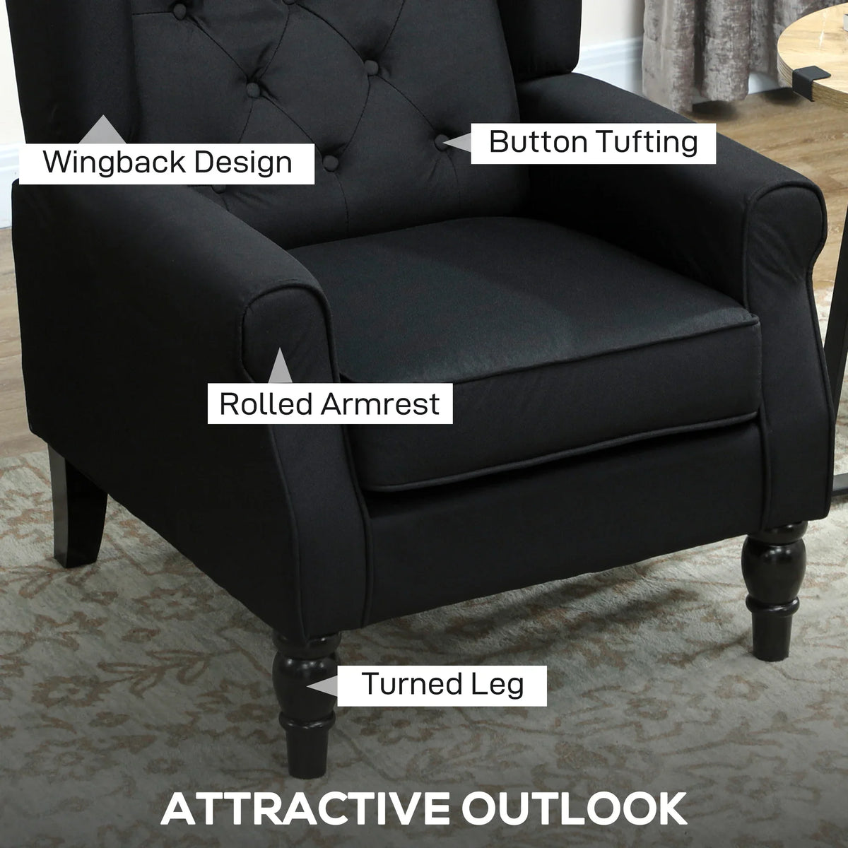 Black wingback armchair with rolled arms, button-tufted seat back, and turned legs