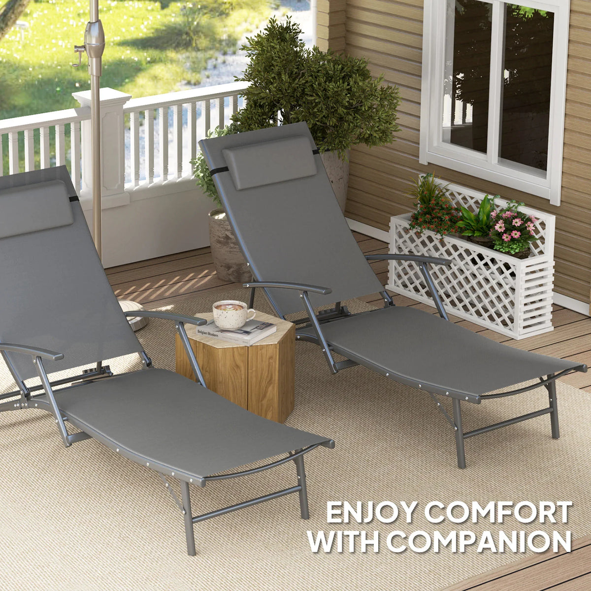 Grey adjustable back sun lounger chair with head pillow on patio deck