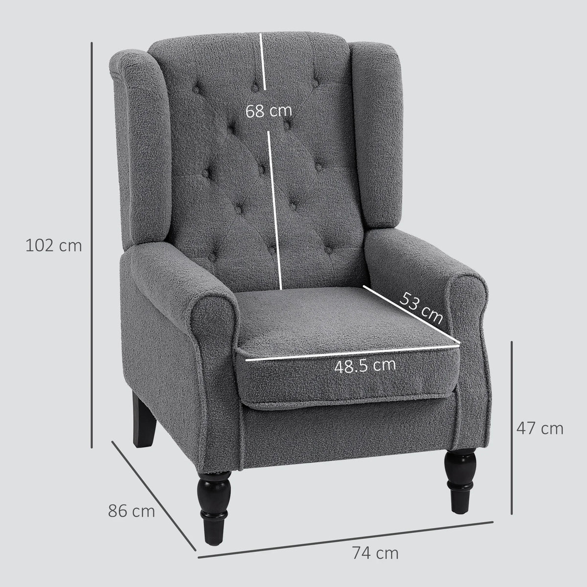 Grey wingback armchair with tufted back, cushioned seat, and turned wooden legs