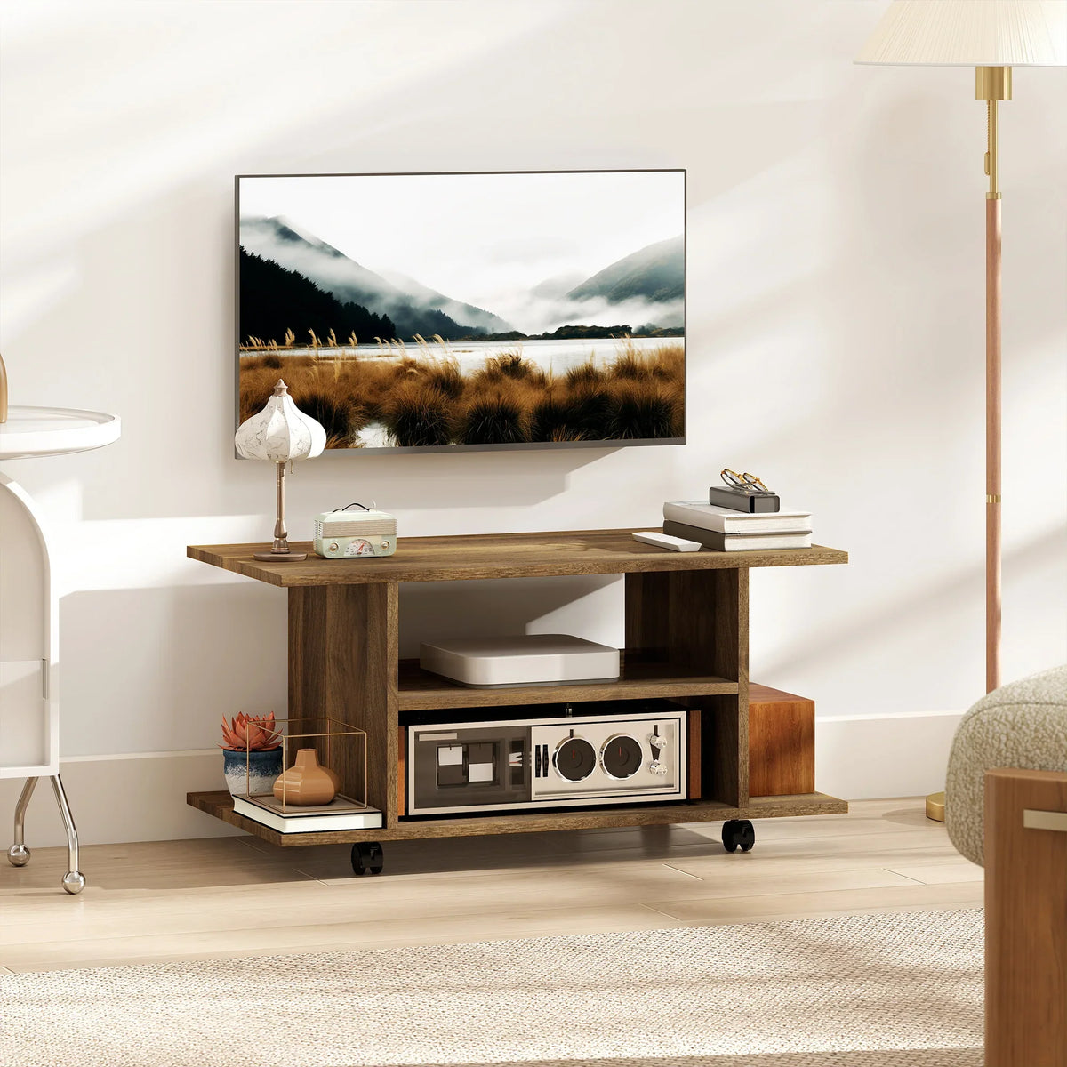 Walnut TV console with open shelves and media storage, on caster wheels