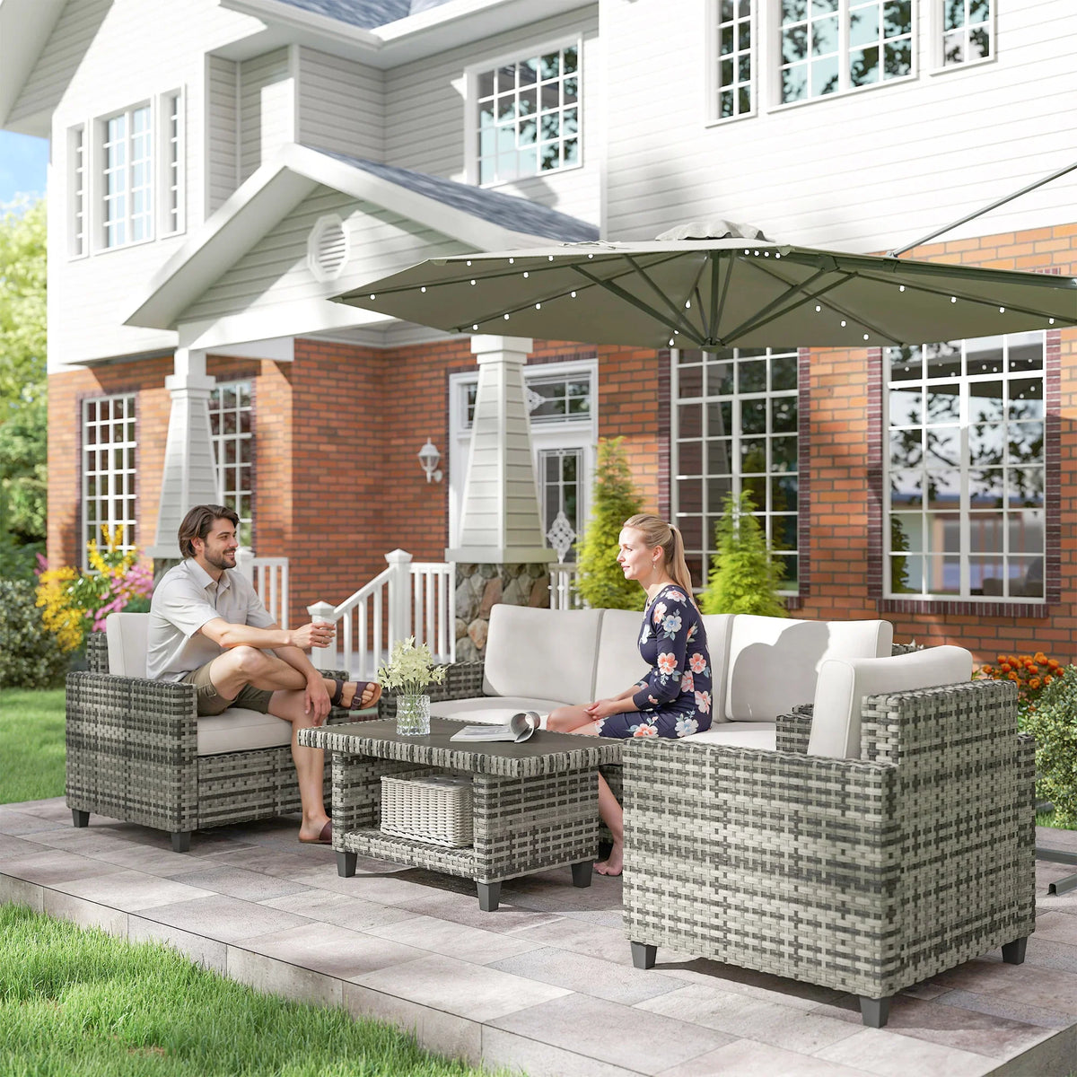 Light grey modular rattan outdoor sofa set with cushions and rectangular coffee table