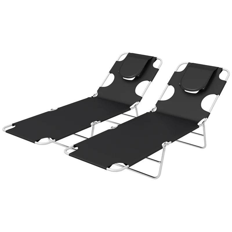 Two black foldable sun loungers with adjustable head sections and arm slot openings