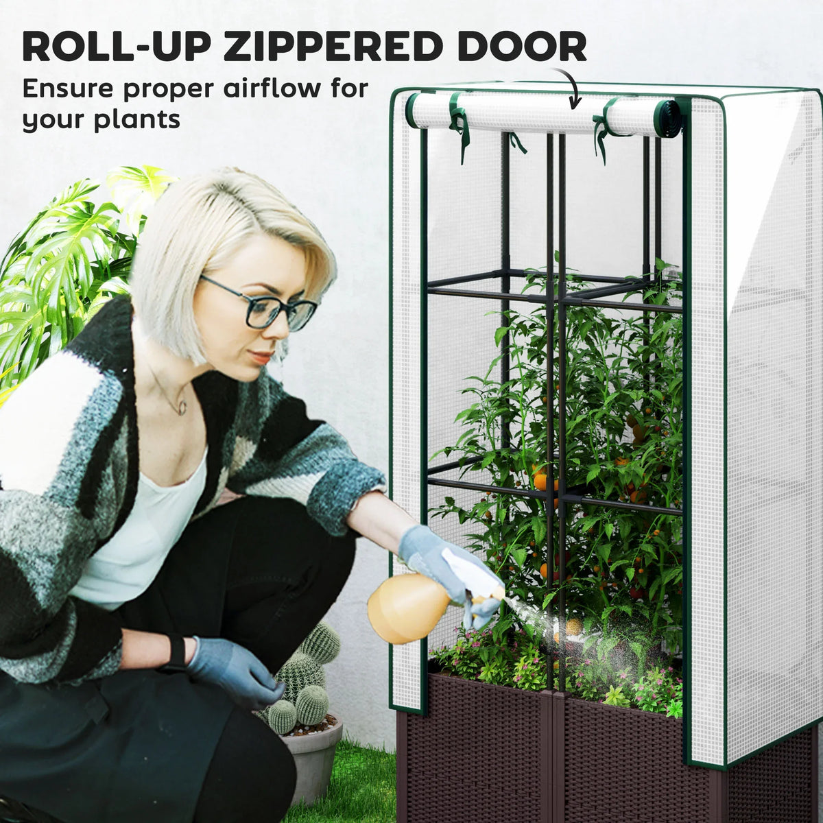 Raised garden bed with roll-up zipped PE door and green trellis over plants