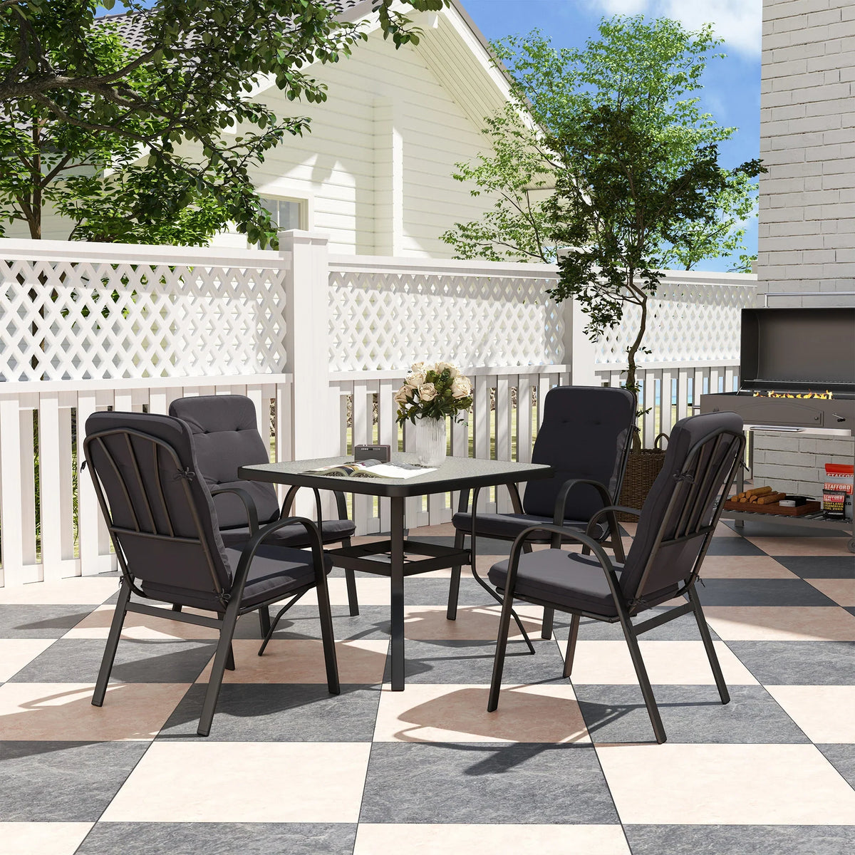 Outdoor dining set with square table and four dark cushioned armchairs