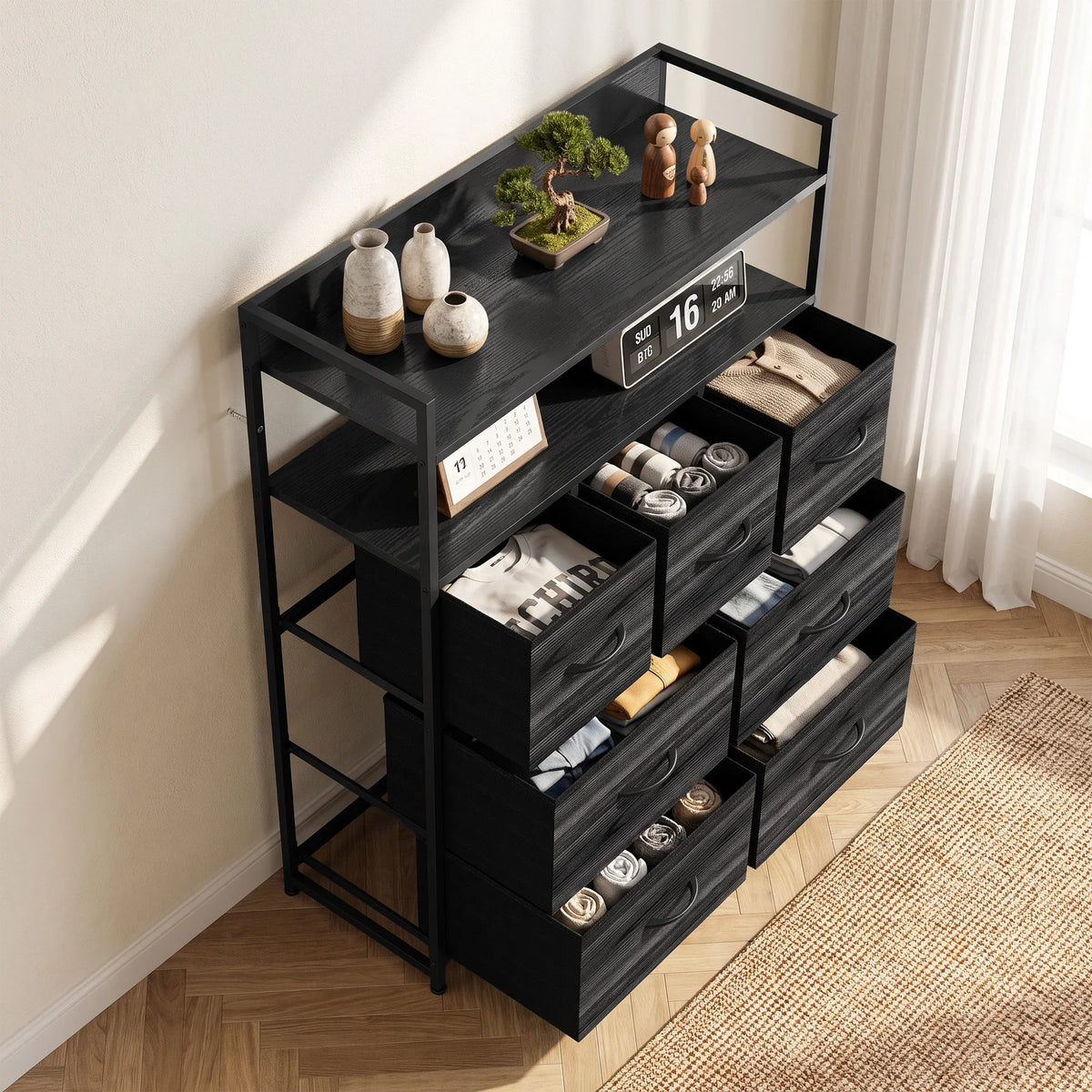 Black fabric dresser with open shelves and seven drawers, shown in angled view