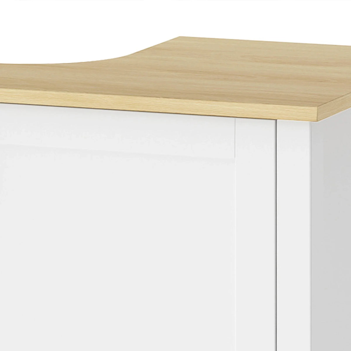 Light wood tabletop edge on white under-sink cabinet with two door panels.